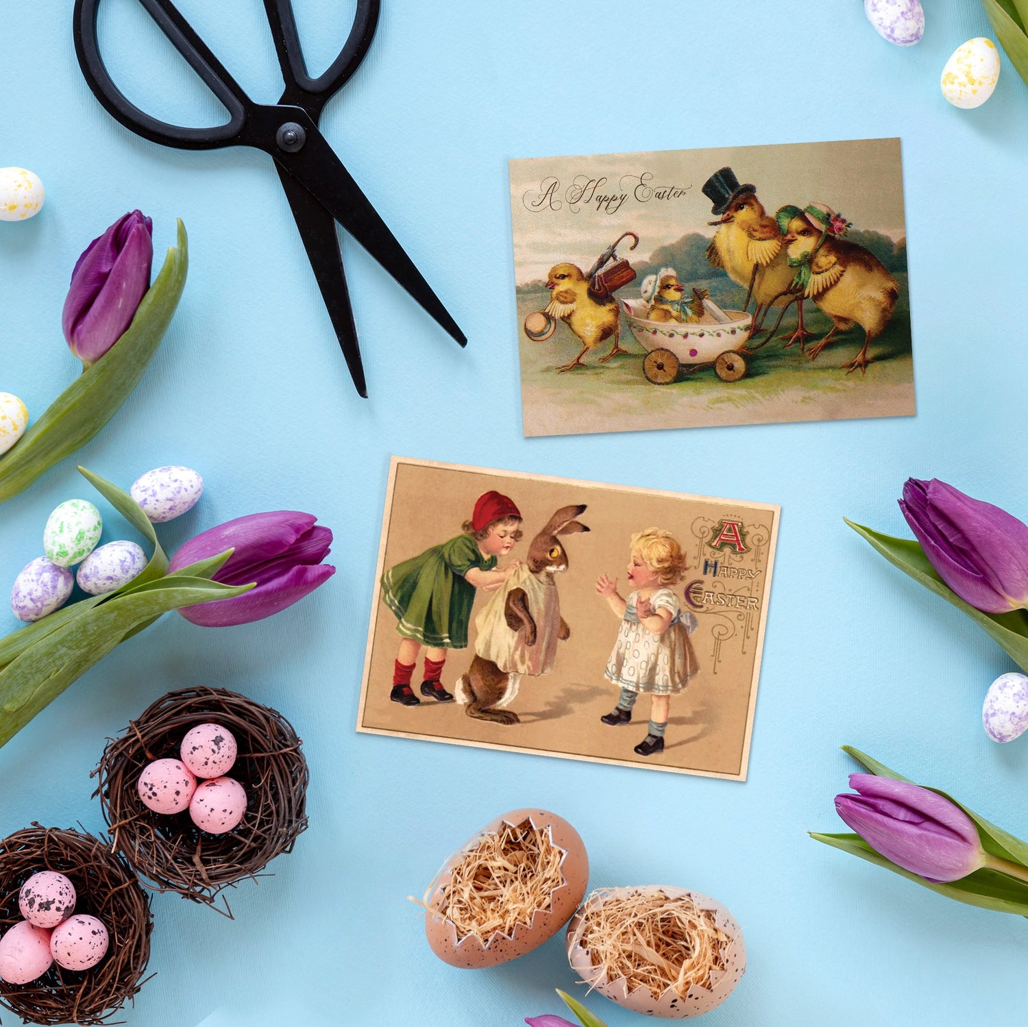 A top view of the desk filled with Easter accessories and goods, including two Victorian period quirky and weird Easter postcards