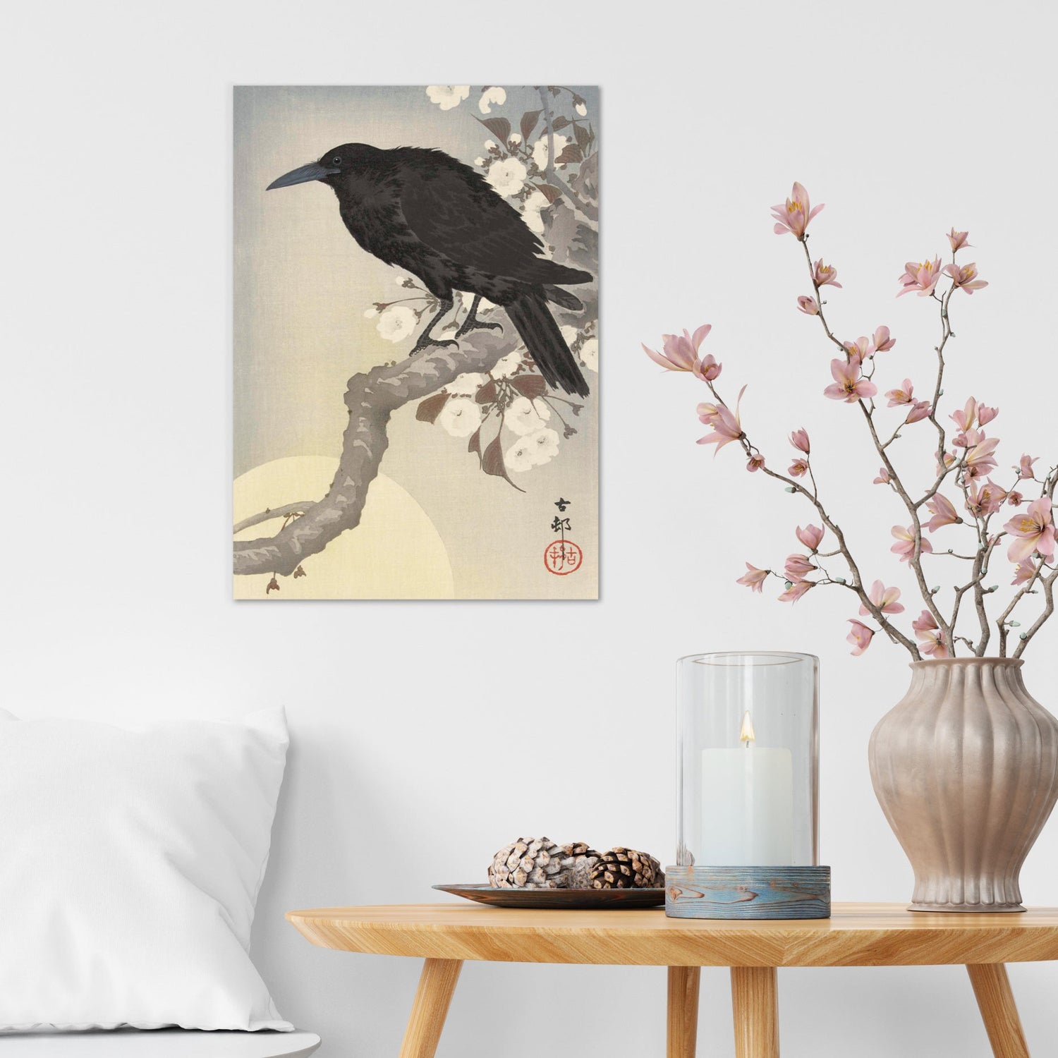 A modern interior in soft hues with a Japanese ukiyo-e art print on the wall featuring Ohara Koson's artwork "Crow and the Full Moon"