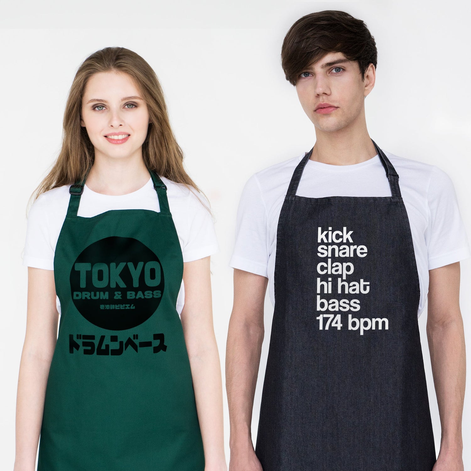 Female and male models wearing bottle-green and black denim aprons printed with bold designs