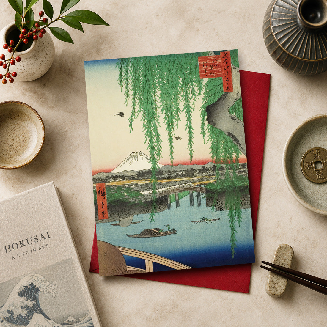 Japanese art greeting card featuring “Yatsumi Bridge” (八ツ見のはし / Yatsumi no Hashi), 1856
by Utagawa Hiroshige (1797–1858), from the series One Hundred Famous Views of Edo.
