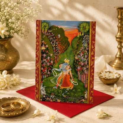A large Indian art greeting card featuring Radha and Krishna Walk in a Flowering Grove, ca. 1720, by the Kota Master.
Radha and Krishna walk together through an exquisitely lush garden filled with flowering trees, birds and peacocks beneath a glowing evening sky.