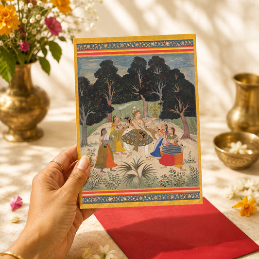 A large Indian art greeting card featuring Vasant Ragini, ca. 1710, from a Ragamala series — a painted Garland of Musical Modes.
Spring comes vividly to life in this joyful scene, where a nobleman dances among musicians beneath flowering trees. Blossoms, movement and brilliant colour fill the composition, turning the painting into a celebration of music, renewal and the exuberance of the changing season.